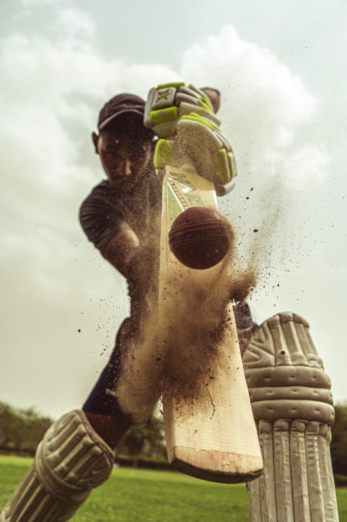 Cricket batsman striking the ball